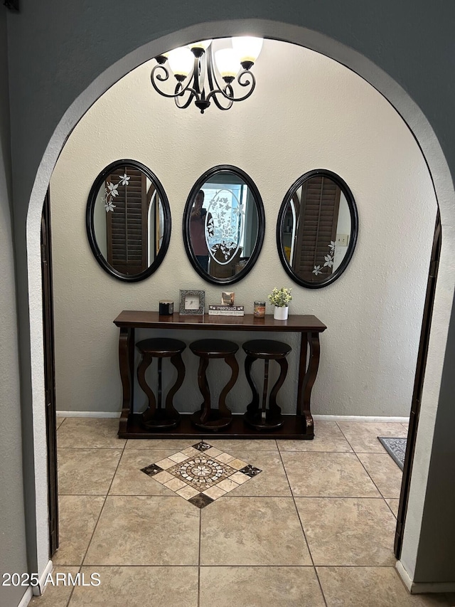 5143 W Mountain View Rd, Glendale, AZ 85302 - detailed view of a chandelier, arched walkways, and baseboards