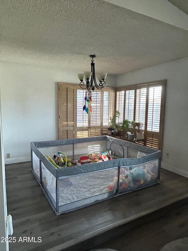 5143 W Mountain View Rd, Glendale, AZ 85302 - dining space with baseboards, wood finished floors, a chandelier, and a textured ceiling