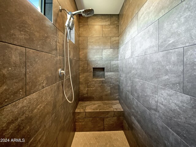 bathroom with tiled shower