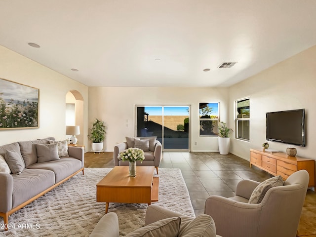 living room with tile patterned flooring