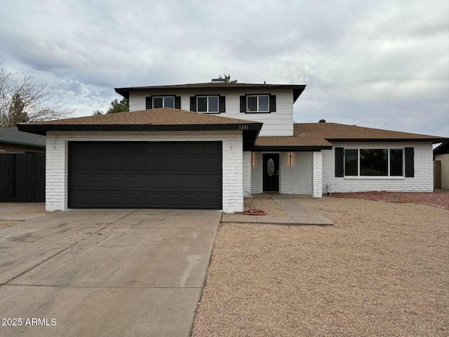 5431 W Cholla St, Glendale, AZ 85304 - prairie-style home featuring an attached garage, roof with shingles, driveway, and brick siding