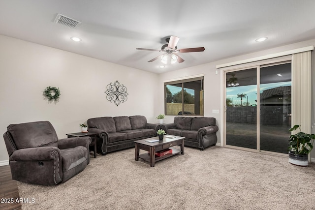 living room featuring ceiling fan, visible vents, and recessed lighting