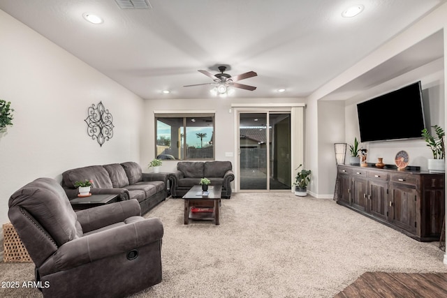 carpeted living room featuring visible vents, recessed lighting, a ceiling fan, and baseboards