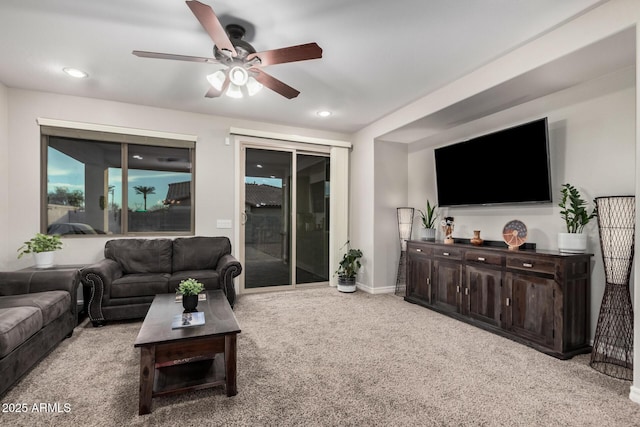 carpeted living area with baseboards, a ceiling fan, and recessed lighting