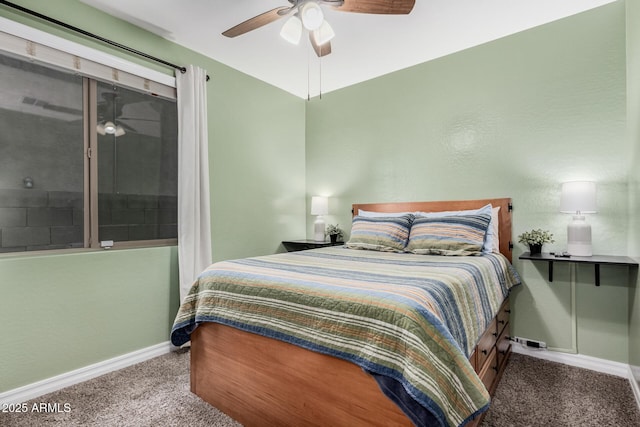 carpeted bedroom with ceiling fan and baseboards