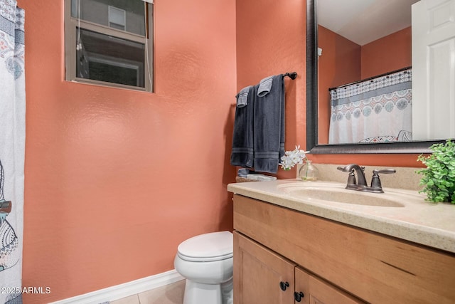 full bath featuring curtained shower, toilet, vanity, tile patterned flooring, and baseboards