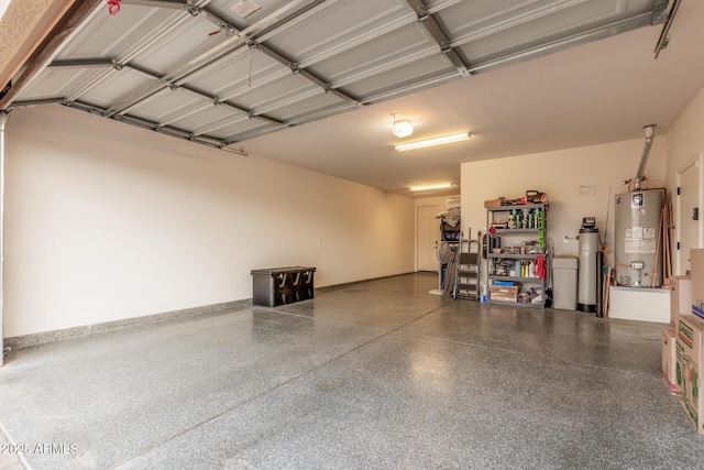 garage with water heater and baseboards