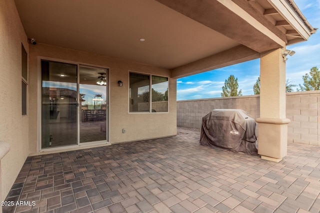 view of patio / terrace featuring fence and grilling area