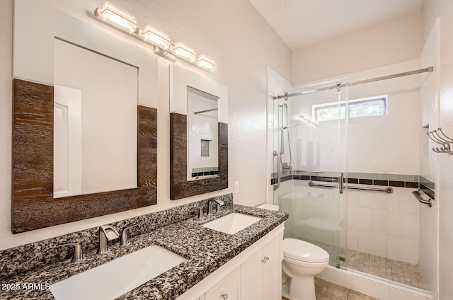 bathroom with walk in shower, vanity, toilet, and tile patterned flooring