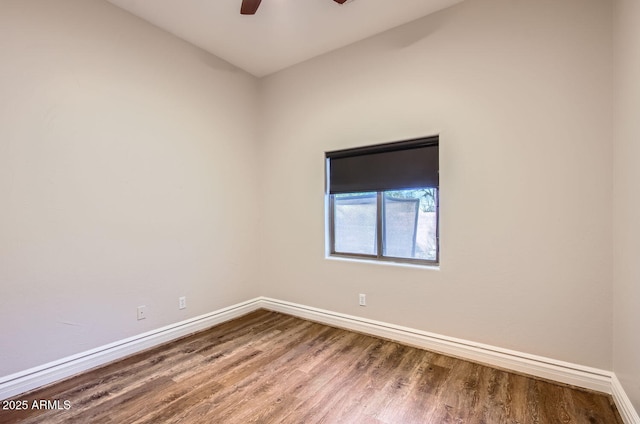 empty room with hardwood / wood-style flooring and ceiling fan