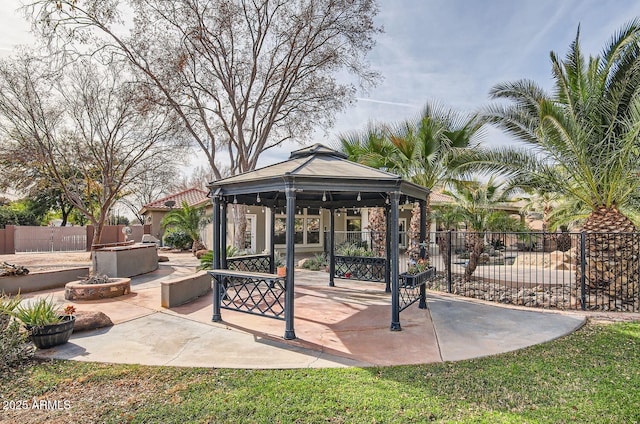 view of patio / terrace featuring a fire pit and a gazebo