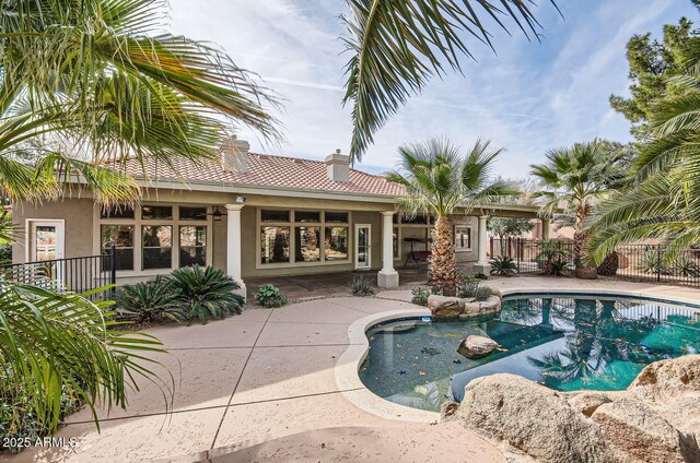 view of swimming pool with a patio