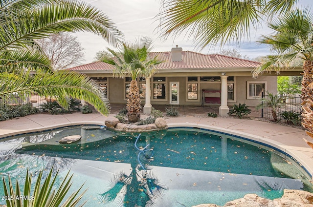 view of swimming pool featuring a patio area