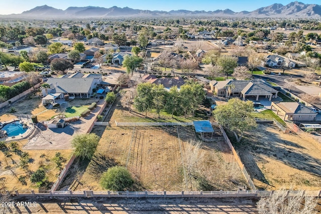 birds eye view of property with a mountain view