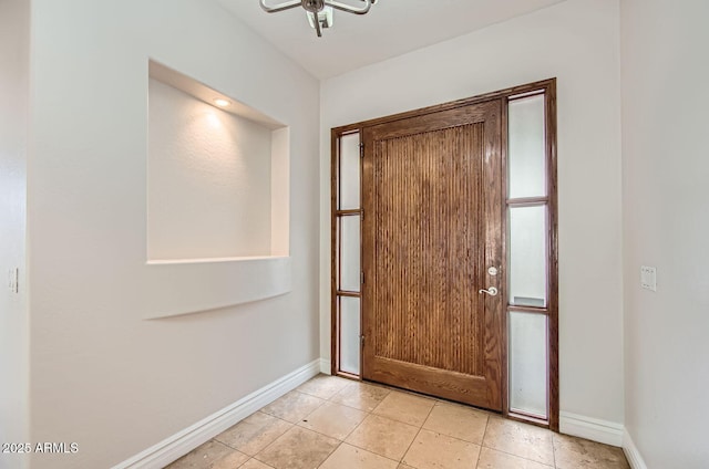 foyer entrance with light tile patterned floors