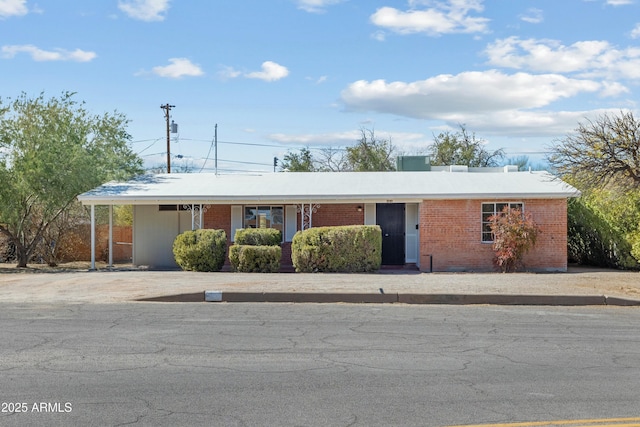 single story home with brick siding