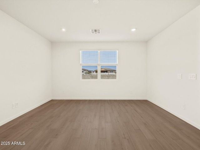 empty room featuring hardwood / wood-style flooring