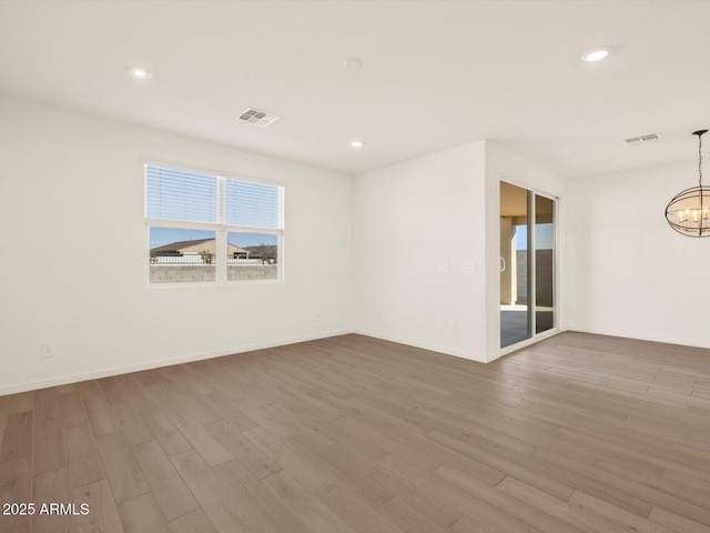 unfurnished room featuring hardwood / wood-style flooring