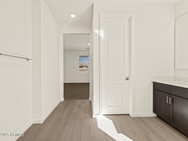 bathroom featuring vanity and wood-type flooring