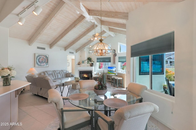 tiled dining room featuring a chandelier, high vaulted ceiling, wooden ceiling, track lighting, and beamed ceiling