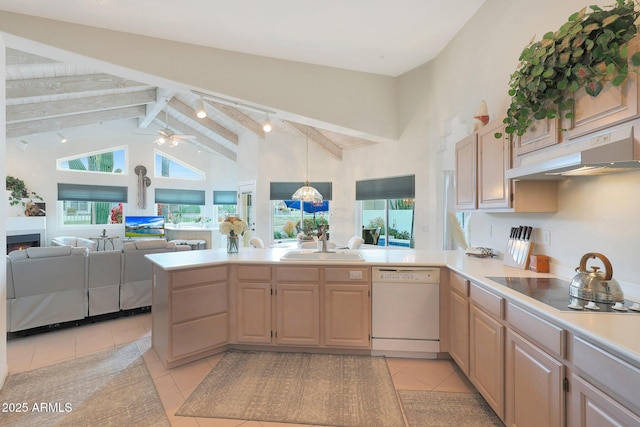 kitchen featuring light brown cabinetry, sink, white dishwasher, kitchen peninsula, and beam ceiling