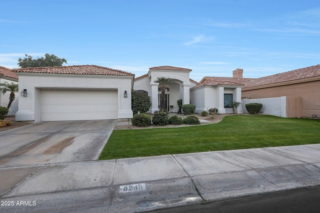 mediterranean / spanish-style home with a garage and a front lawn