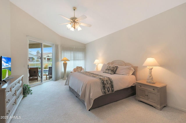 bedroom with access to exterior, vaulted ceiling, light colored carpet, and ceiling fan