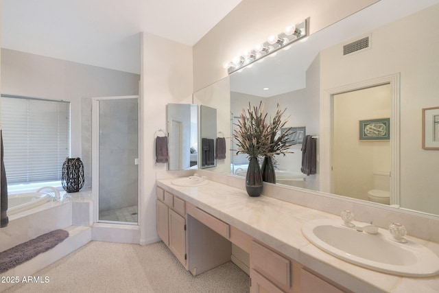 full bathroom with vanity, toilet, and separate shower and tub