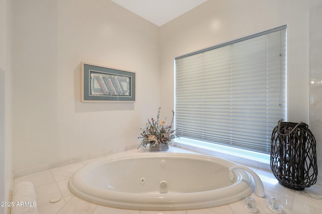 bathroom featuring tiled bath