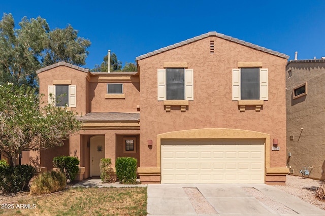 7029 S Golfside Ln, Phoenix, AZ 85042 - view of front facade featuring concrete driveway, an attached garage, and stucco siding