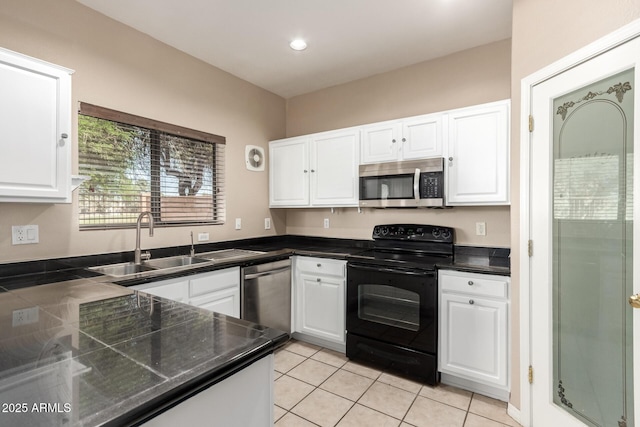 7029 S Golfside Ln, Phoenix, AZ 85042 - kitchen featuring appliances with stainless steel finishes, white cabinetry, light tile patterned floors, and recessed lighting