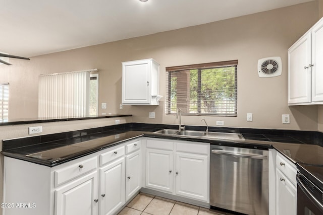 7029 S Golfside Ln, Phoenix, AZ 85042 - kitchen with dishwasher, a peninsula, dark countertops, and white cabinets
