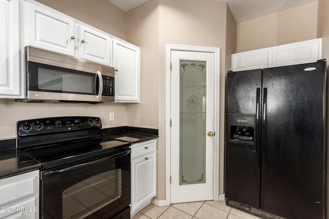 7029 S Golfside Ln, Phoenix, AZ 85042 - kitchen featuring black appliances, white cabinets, dark countertops, and light tile patterned floors