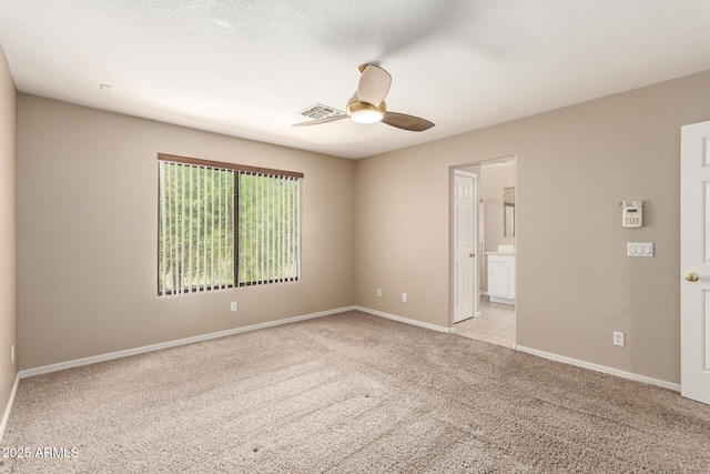 7029 S Golfside Ln, Phoenix, AZ 85042 - spare room with ceiling fan and light carpet