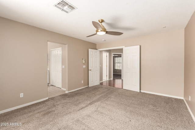 7029 S Golfside Ln, Phoenix, AZ 85042 - unfurnished bedroom featuring carpet flooring and a ceiling fan