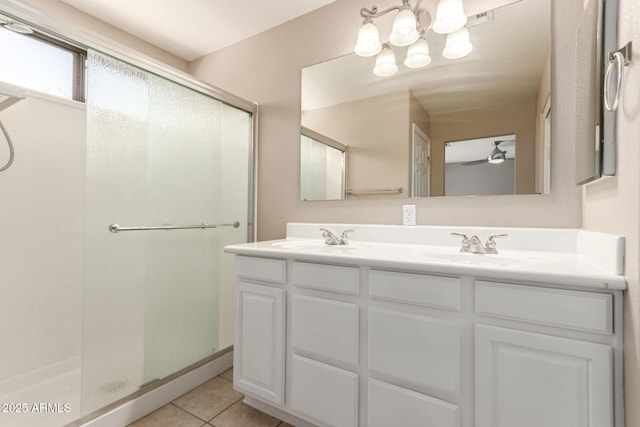 7029 S Golfside Ln, Phoenix, AZ 85042 - full bath with double vanity, a stall shower, tile patterned flooring, and a chandelier