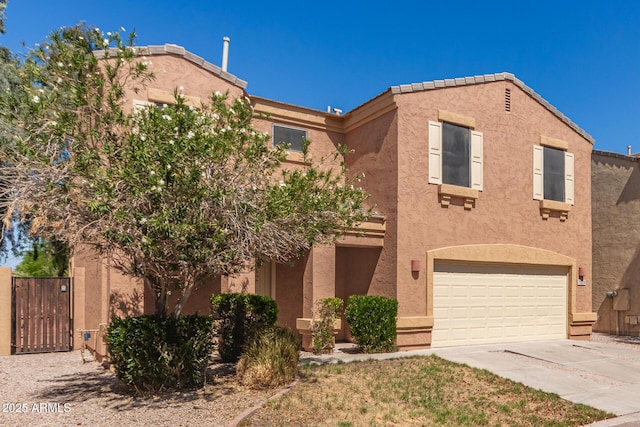 7029 S Golfside Ln, Phoenix, AZ 85042 - view of front of house featuring concrete driveway, stucco siding, a garage, and a gate
