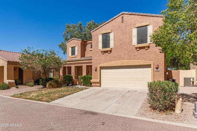 7029 S Golfside Ln, Phoenix, AZ 85042 - view of front of home featuring stucco siding, driveway, and a garage