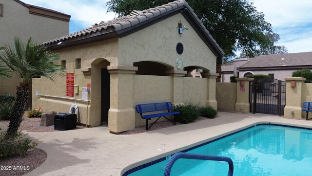 7029 S Golfside Ln, Phoenix, AZ 85042 - community pool featuring a gate and a patio