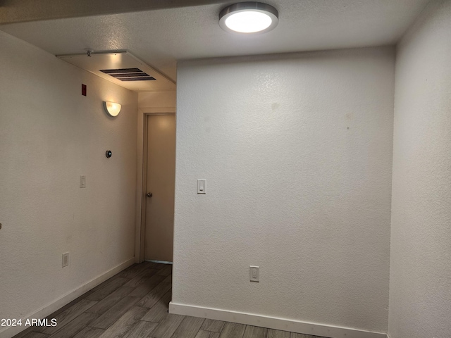 spare room featuring dark hardwood / wood-style floors