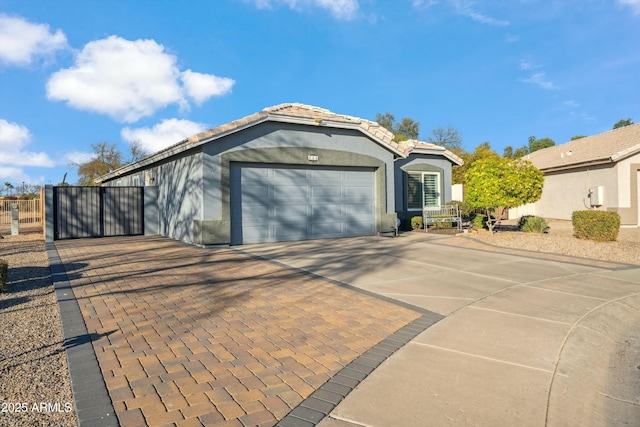 garage featuring decorative driveway