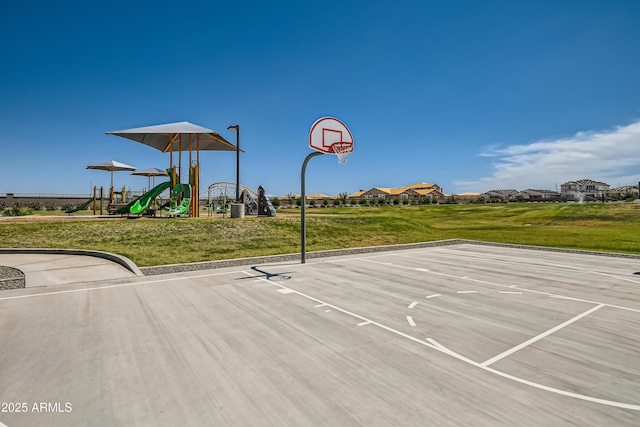 view of basketball court featuring community basketball court, a lawn, and playground community