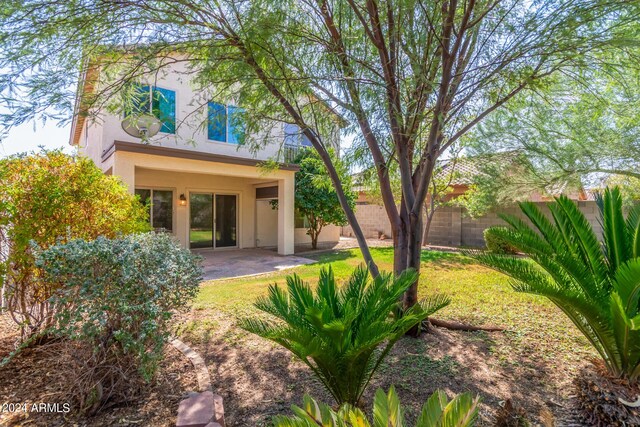 back of house with a patio