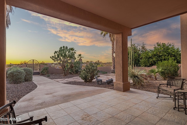 view of patio terrace at dusk