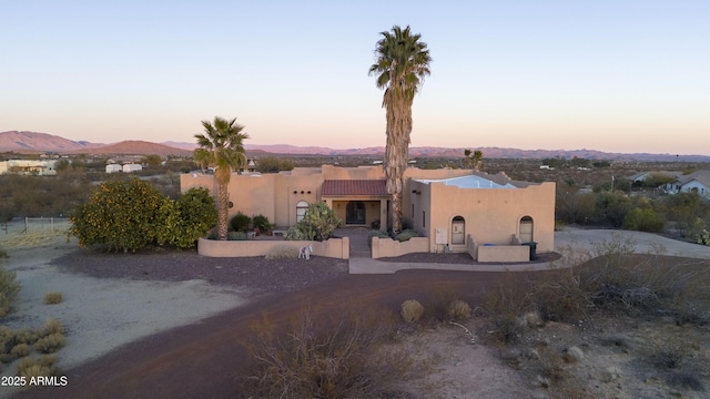 view of front of house featuring a mountain view