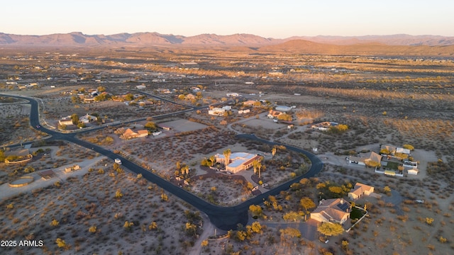 aerial view at dusk with a mountain view