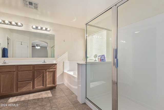 full bathroom featuring a stall shower, visible vents, tile patterned floors, a sink, and a bath