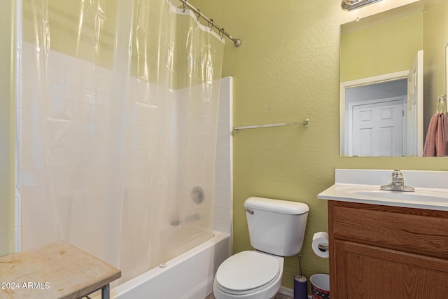 full bathroom featuring toilet, a textured wall, shower / tub combo with curtain, and vanity