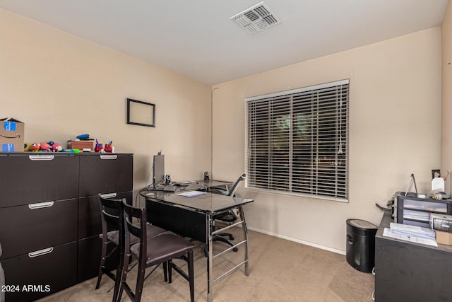 office area featuring baseboards, visible vents, and carpet flooring