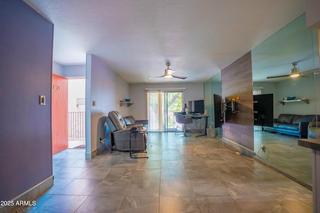 living area with ceiling fan